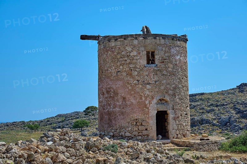 Abandoned old mill on a hill, surrounded by stones, under a clear blue sky, windmill, ruin, near Lindos, Lindos, Rhodes, Dodecanese, Greek Islands, Greece, Europe