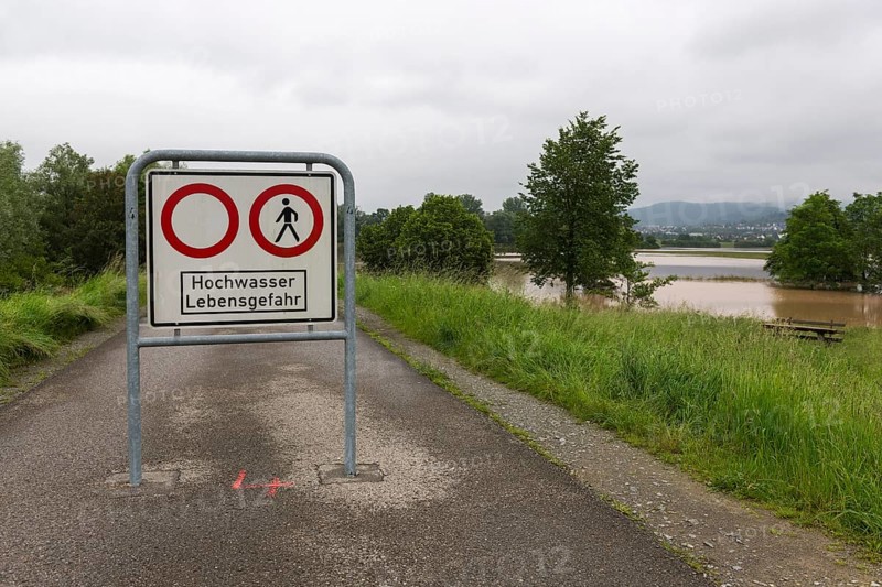 Symbolic image extreme weather, global warming, climate change, information board, flood retention basin, flood protection, danger to life, flooded meadows, deciduous trees, Rems valley, Winterbach, Rems river, Baden-Württemberg, Germany, Europe