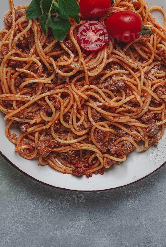 Spaghetti bolognese, in a frying pan, top view, homemade, no people