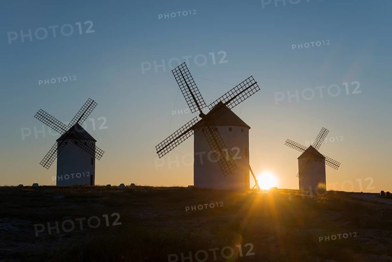 Three windmills in the sunrise light, dominating the gentle peaceful landscape, Campo de Criptana, Ciudad Real province, Castilla-La Mancha, Route of Don Quixote, Spain, Europe