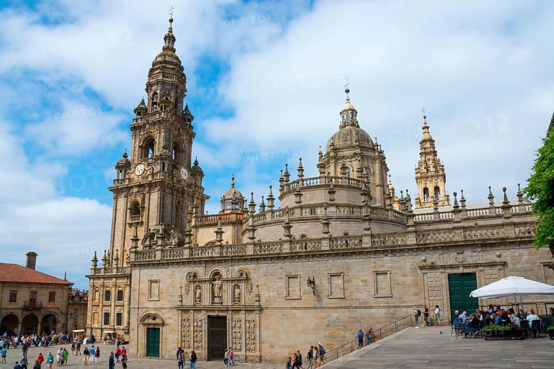 Historic cathedral in baroque style with towers against a blue sky and people in the square, Cathedral, Plaza de la Quintana, Santiago de Compostela, autonomous community of Galicia, place of pilgrimage, destination of the Way of St James, Spain, Europe