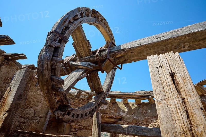 Close-up of a wooden cogwheel and wooden beams in an abandoned old mill under a clear sky, windmill, ruin, near Lindos, Lindos, Rhodes, Dodecanese, Greek Islands, Greece, Europe