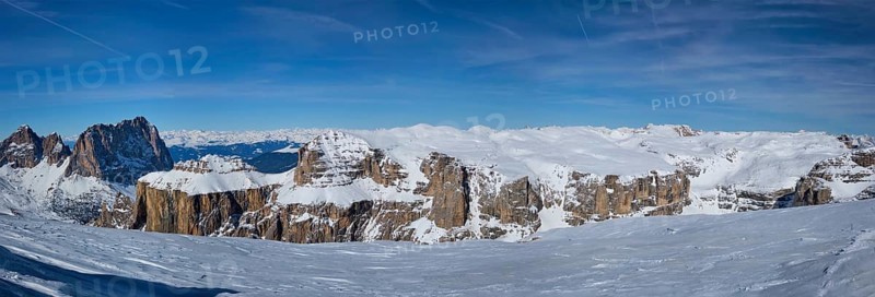 Panorama of a ski resort piste and Dolomites mountains in Italy from Passo Pordoi pass. Arabba, Italy, Europe