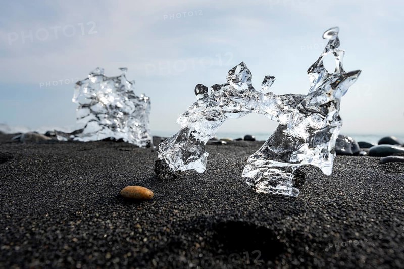 Ice, piece of ice on black sand beach, on black lava beach Diamond Beach, Southeast Iceland, Iceland, Europe