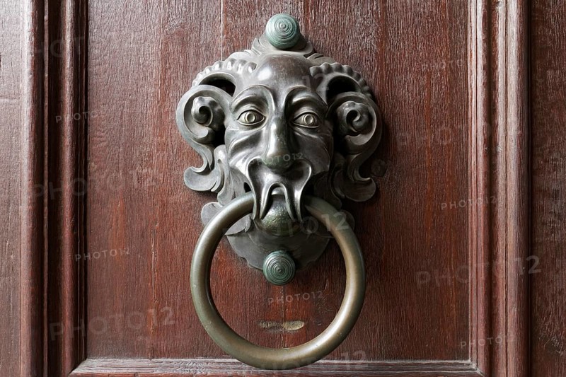 Old door knocker with face of a mythical creature, New Residence, Bamberg, Upper Franconia, Bavaria, Germany, Europe