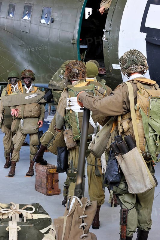 Uniforms of American soldiers and Douglas C-47 aircraft in the Airborne Museum in Sainte-Mere-Église, Normandy, France, Europe