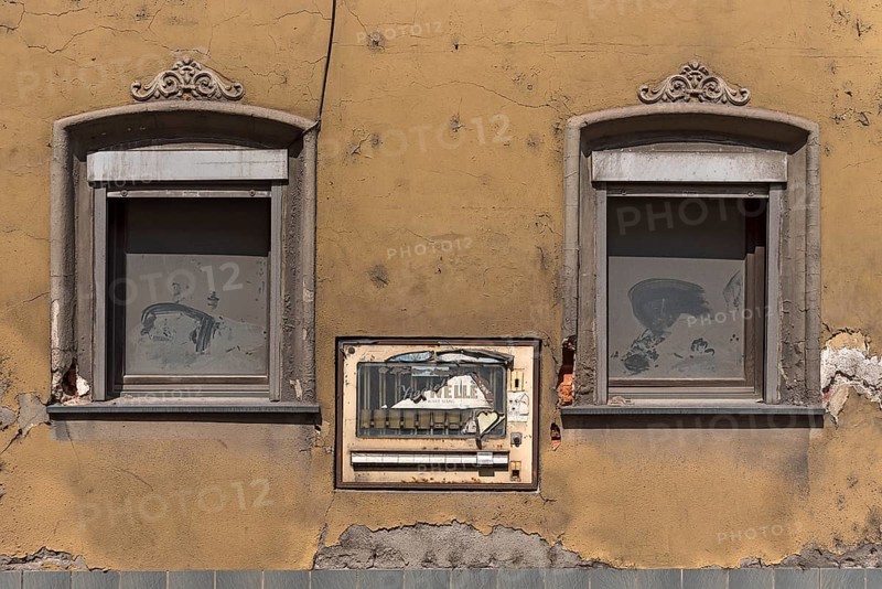 Old cigarette machine in the wall of an old house, Eltmann, Lower Franconia, Bavaria, Germany, Europe
