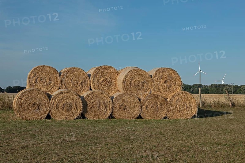 Stack of round bales, straw, wind turbines, agriculture, Allerstorf, Marlow, Mecklenburg-Western Pomerania, Germany, Europe