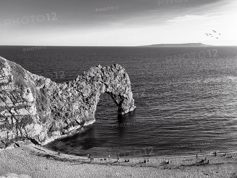 Durdle Door Bathing Beach, Limestone Rock Bridge, UNESCO World Heritage Site, Dorset Landmark, Chalk Coast, Monochrome, England, United Kingdom, Europe