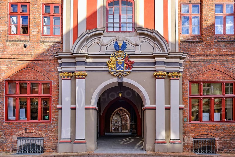 Baroque grand portal with city coat of arms from the Swedish occupation period on the west side of the town hall, which leads via the so-called butter aisle to the west portal of St. Nicholas Church, Hanseatic City of Stralsund, Mecklenburg, Western Pomerania