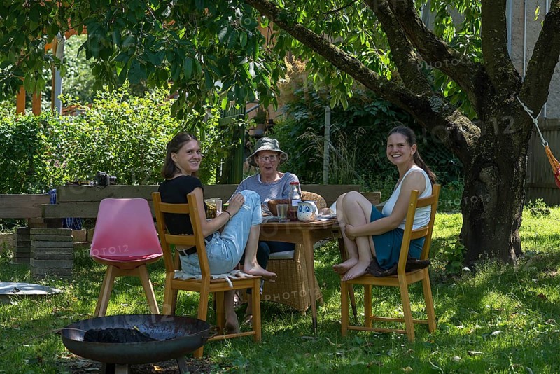 Three woman drinking coffee in the garden, Mecklenburg-Vorpommern, Germany, Europe