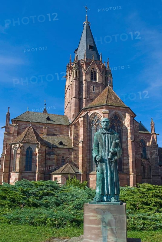 Old Gothic abbey church with monk Paul in Wissembourg, Alsace, France, Europe