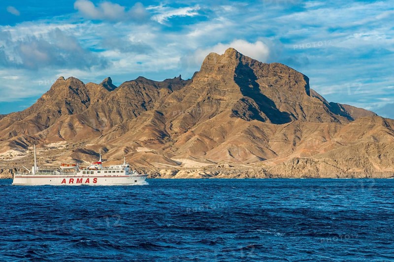 Ferry in the sea, mountains in background. San Vincente. Mindelo. Cabo Verde. Africa