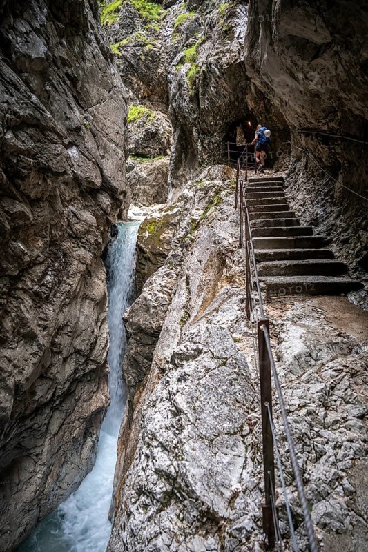 Hiker in a gorge, Hammersbach flows through Höllentalklamm, near Garmisch-Partenkirchen, Werdenfelser Land, Upper Bavaria, Bavaria, Germany, Europe