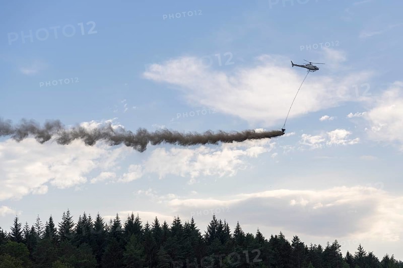 Symbolic image, climate change, helicopter, helicopter spreading finely painted limestone and wood ash against acid rain, mixed forest, container, soil protection liming, forest liming, Baden-Württemberg, Germany, Europe