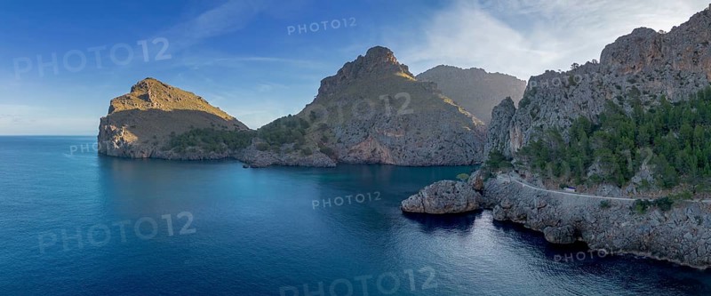 A panorama landscape view of the rugged and mountainous coastline at Sa Calobra in northern Mallorca