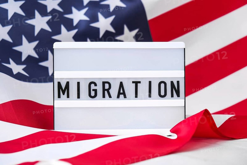 American flag. Lightbox with text MIGRATION Flag of the united states of America. July 4th Independence Day. USA patriotism national holiday. Usa proud. Freedom concept