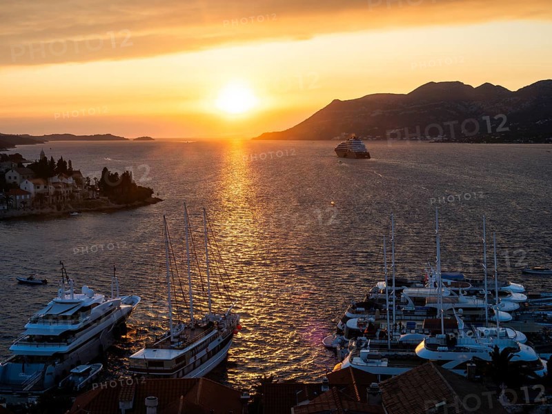 Evening atmosphere at sunset by the sea, view from the bell tower, ships in Korcula harbour, Korcula island, Dalmatia, Croatia, Europe