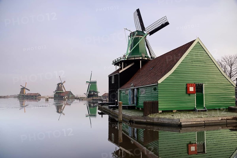 Windmill in the Dutch traditional village Zaanse Schans which is one of the busiest tourist locations in the Netherlands