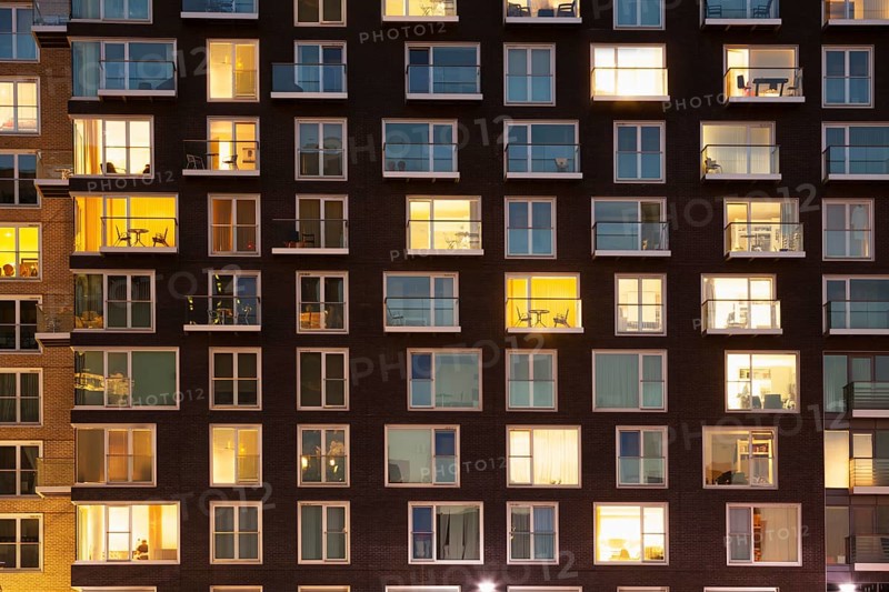Modern apartment building at dusk