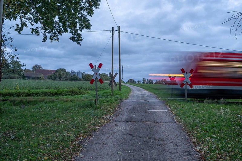 Passing Gräfenberg railway, single-track branch line, at the unrestricted level crossing, Igensdorf, Upper Franconia, Bavaria, Germany, Europe