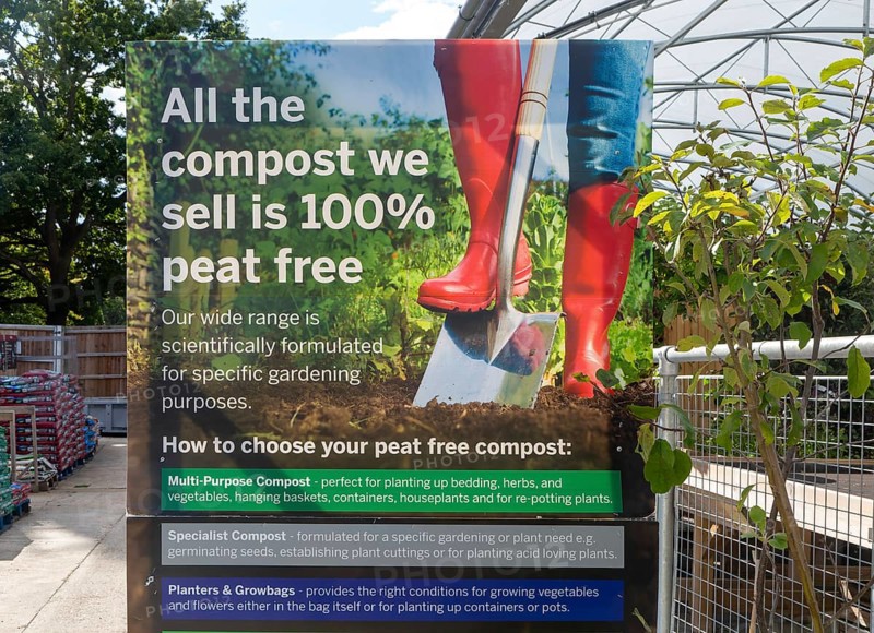 Sign advertising 100% peat free compost, Notcutts garden centre, Woodbridge, Suffolk, England, UK