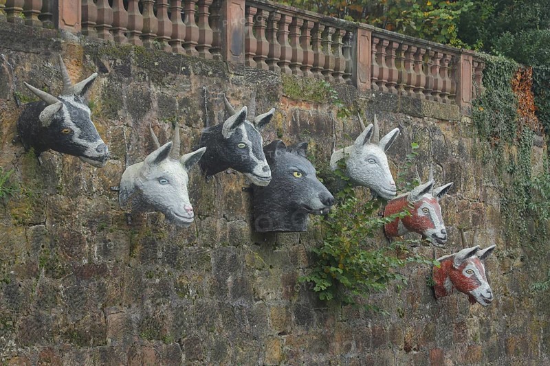 Sculptures by Pasquale Ippolito on the Brothers Grimm fairy tale The Wolf and the Seven Little Goats, goat heads, goat head, wolf figure, wolf head, series, series, stone wall, six, Grimm-Dich-Pfad, Marburg, Hesse, Germany, Europe