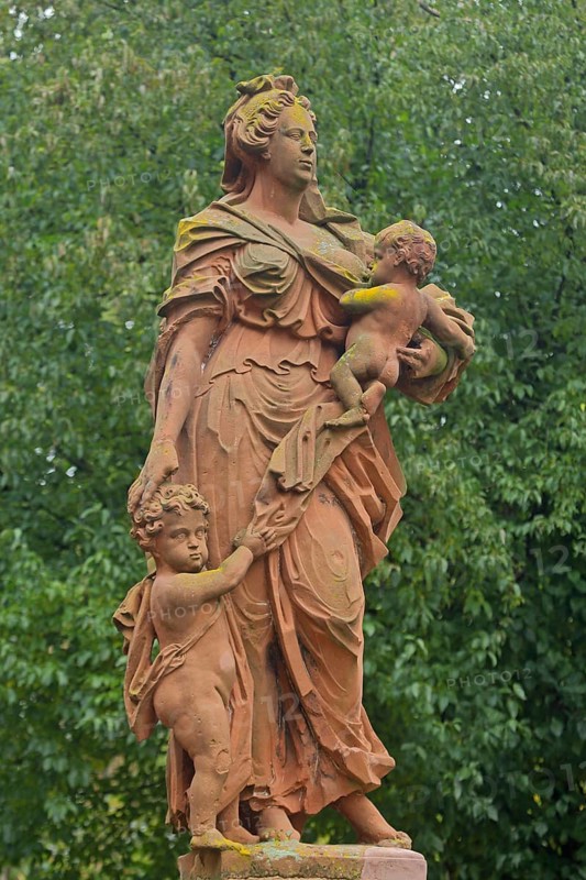Sculpture by the baroque sculptor Johann Friedrich Joseph Sommer on virtue : love, caritas, female figure with two children, carry, protect, guard, charity, care, allegory, symbol, virtues, baroque, Firmaneiplatz, Marburg, Hesse, Germany, Europe