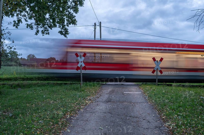 Passing Gräfenberg railway, single-track branch line, at the unrestricted level crossing, Igensdorf, Upper Franconia, Bavaria, Germany, Europe