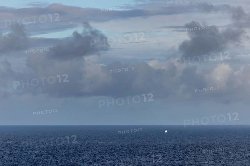 View over the sea to the horizon, clouds and white sailing ship, Mainland Orkney, Scotland, Great Britain