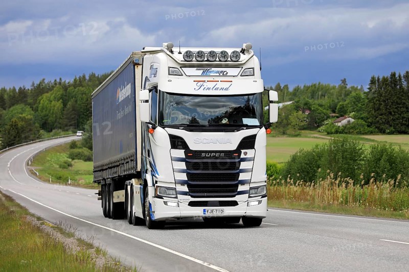 Customised Scania S500 truck of Transport K. Lindholm & Co pulls semi trailer along highway in the summer in Finland. Salo, Finland. June 8, 2023