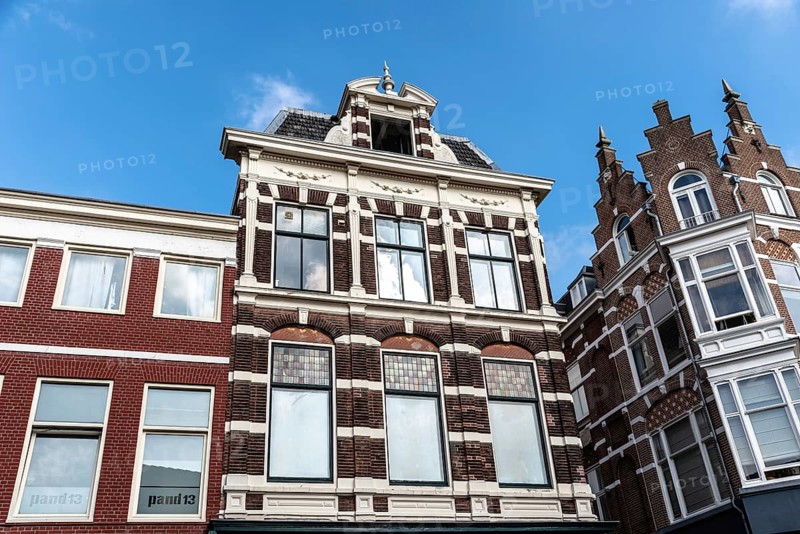 Haarlem, Netherlands, May 07, 2022: Low angle view of traditional Dutch houses in historic centre