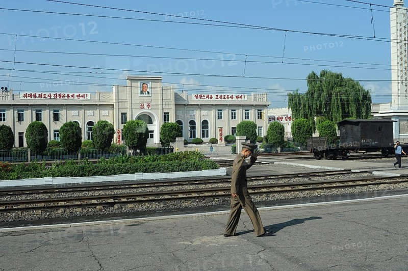 07.08.2012, Democratic People's Republic of Korea, Asia, A soldier walks along a railway platform in the North Korean province, between the border town of Sinuiju and the capital Pyongyang