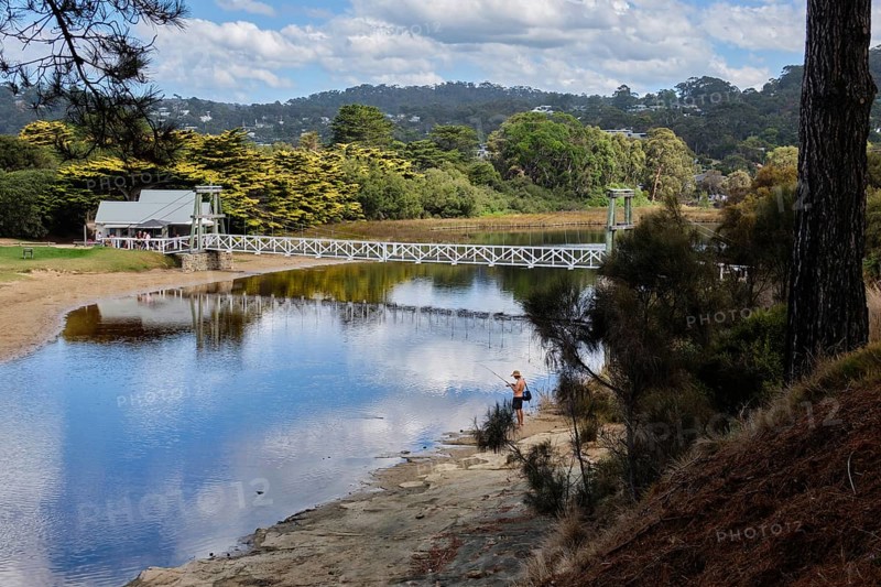An angler at a lovely spot by the Erskine River near the Swing Bridge, Lorne, Victoria, Australia, Oceania