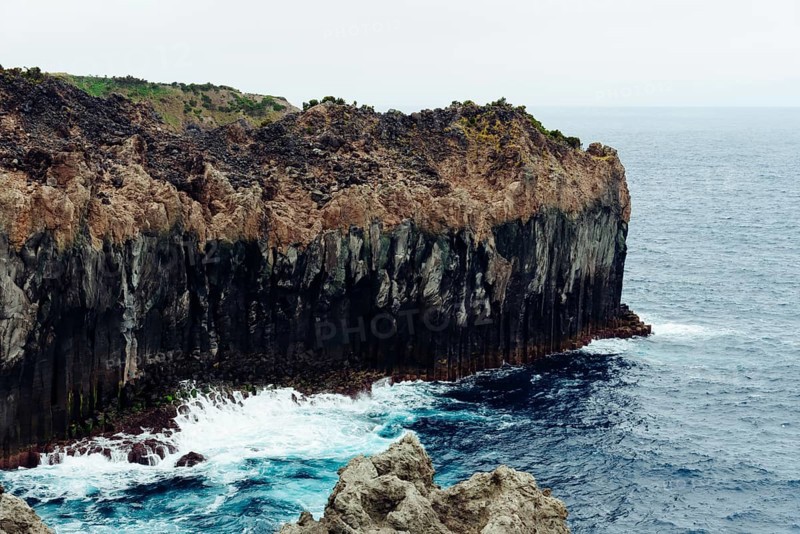 Cliffs in the north coast of Terceira Island, Azores, Portugal. CLoudy day of summer