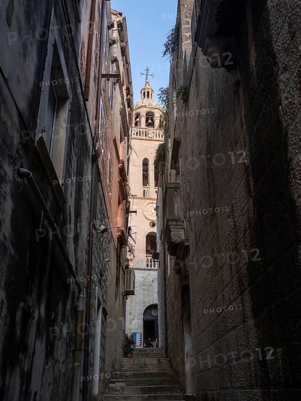 Narrow alley in the old town and church tower, Old Town of Korcula, Dalmatia, Croatia, Europe
