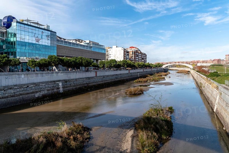 Madrid, Spain, December 9, 2019: Cityscape of Manzanares River in Madrid Rio area, Europe