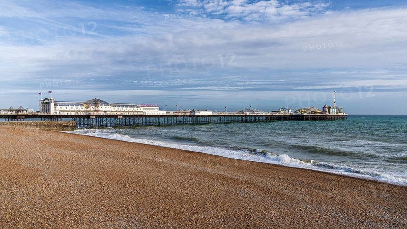 Brighton, East Sussex, England, UK, May 10, 2022: The beach and the Palace Pier