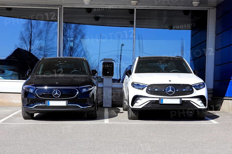 Black Mercedes-Benz EQA 250 battery electric SUV year 2023 and new white Mercedes-Benz 4matic SUV with diamond grill. Salo, Finland. April 10, 2023