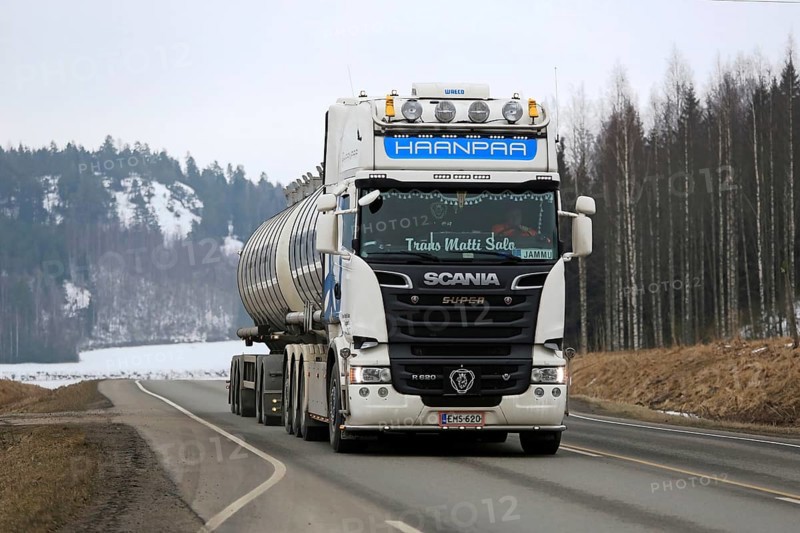 SALO, FINLAND, MARCH 13, 2016: White super Scania R620 tank truck for bulk transport of Trans Matti Salo for Haanpaa moves along highway at spring in South of Finland