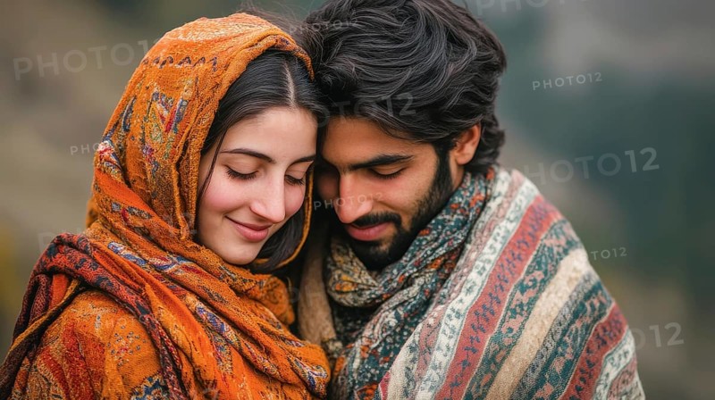 A serene couple wrapped in colorful shawls, their heads close, embodying affection, AI generated