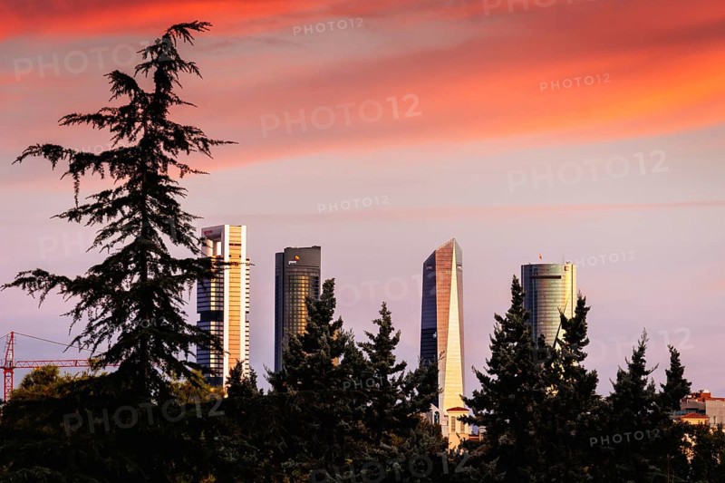 Madrid, Spain, September 11, 2021: Cuatro Torres Financial District at dramatic red color sunrise, Europe