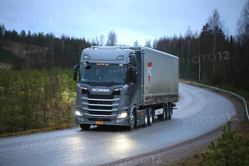 LOHJA, FINLAND, NOVEMBER 24, 2016: New Next Generation Scania R truck on the road in November sleet and rain. Scania Oy presents their new truck range in Finland in November-December 2016