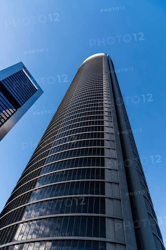 Madrid, Spain, February 7, 2021: Low angle view of skyscrapers in Cuatro Torres financial district. Business and finance concept, Europe