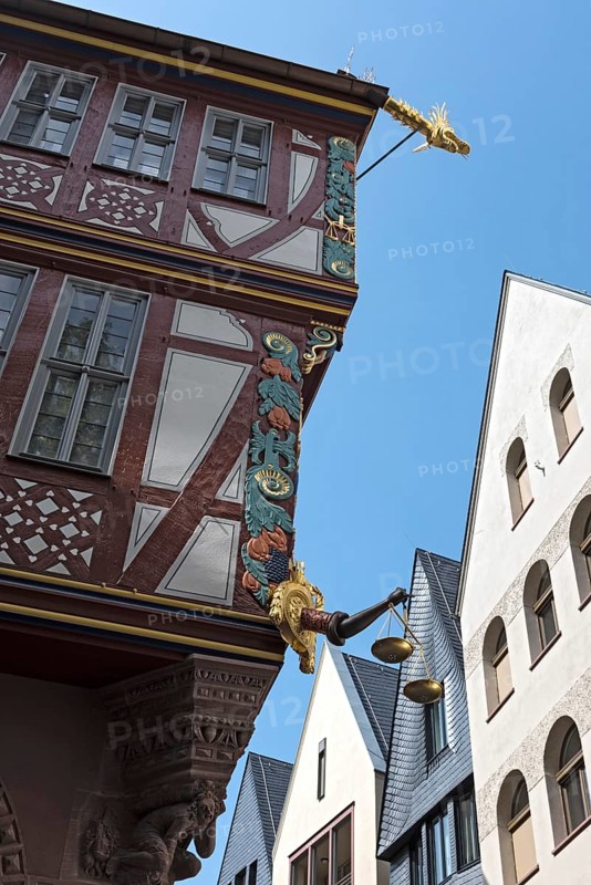 Corner detail of a colorful half timbered house, house to the Golden Libra, in the new historic old town of Frankfurt am Main, Germany, Europe