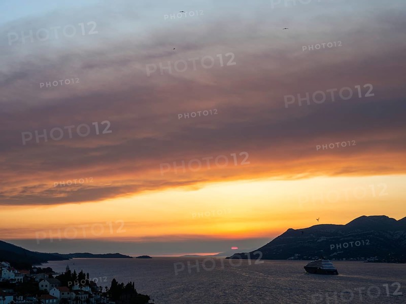 Evening atmosphere at sunset by the sea, view from the bell tower, cruise ship near Korcula, Korcula Island, Dalmatia, Croatia, Europe