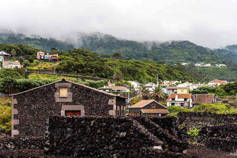 Small village. Traditional rural landscape in Terceira Island a cloudy day of summer. Houses a cloudy day on a green environment