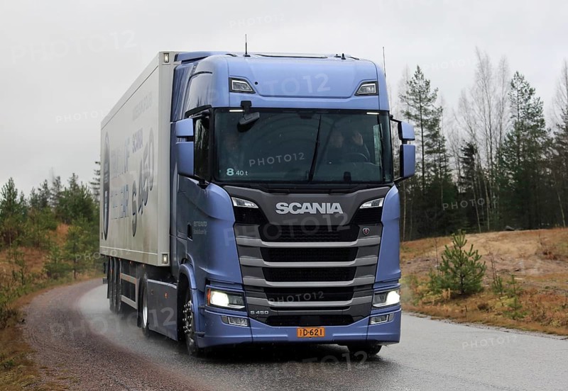 LOHJA, FINLAND, NOVEMBER 24, 2016: New Next Generation Scania S450 Semi truck on the road on a rainy day in November. Scania Oy presents their new truck range in Finland in November-December 2016