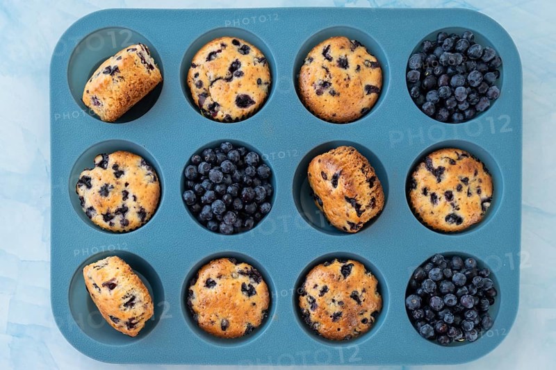 Berry pie in silicone muffin tin. Healthy vegan cupcakes with organic berries. Fresh baked blueberry muffins. Tasty Sweet cupcake. Pastry homemade dessert. Baked in reusable silicon forms