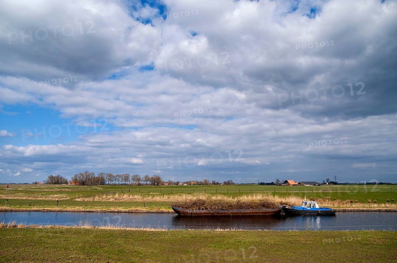Boat on the river Linde near Kuinre in the Dutch province Overijssel